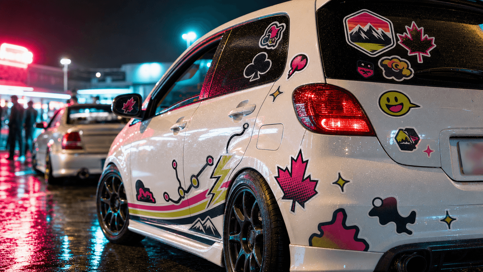 Custom tuner car decals at a night car meet