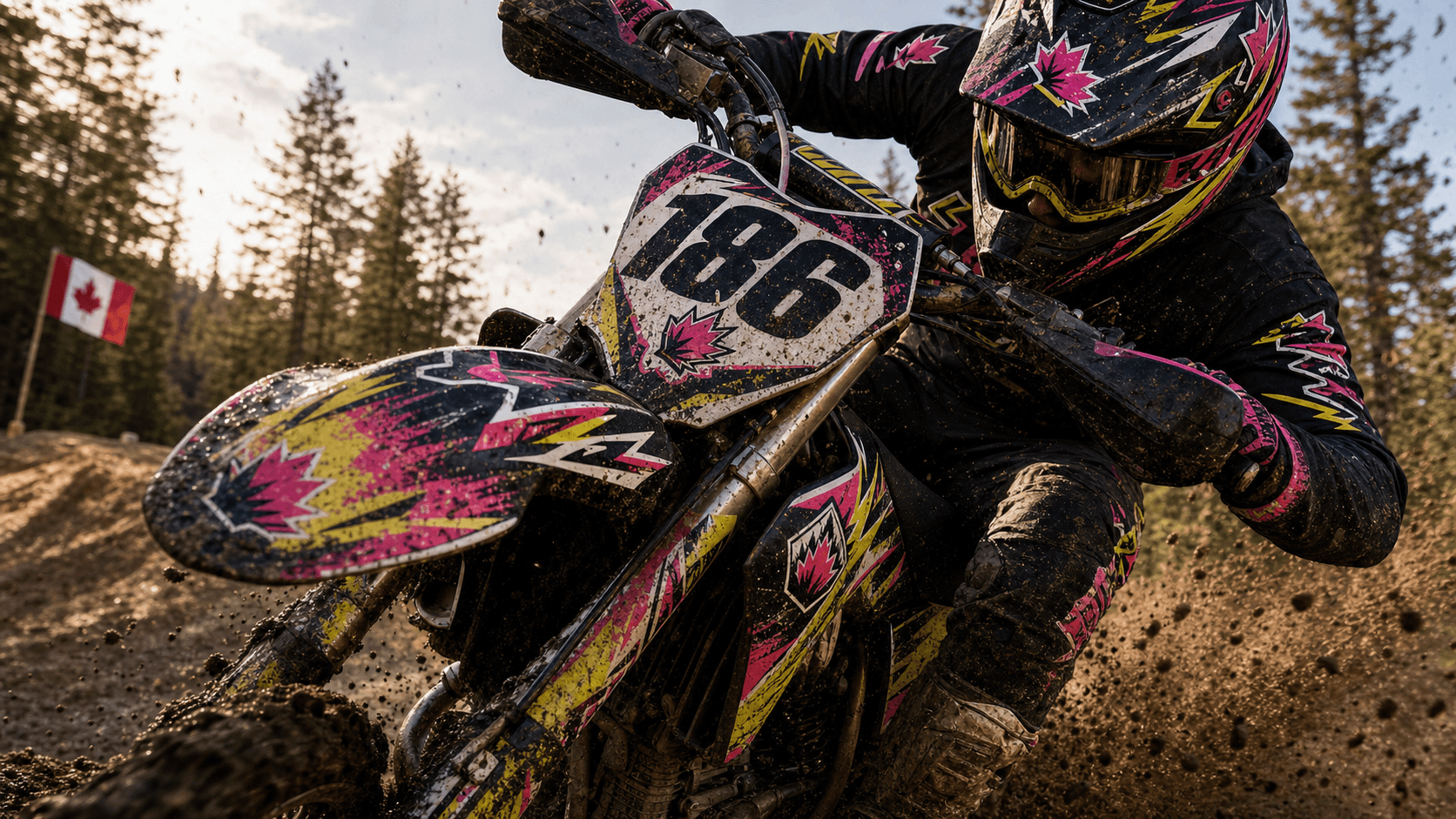 Custom dirt bike decals on a muddy trail bike